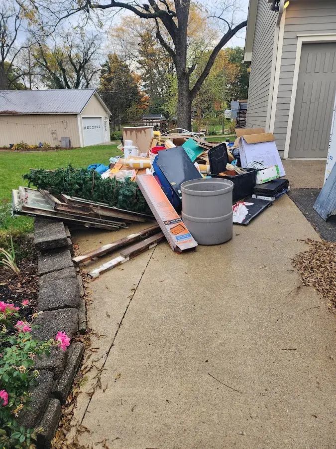 Dumpster being loaded with debris for 30 Yard Dumpster Rental in Princeton